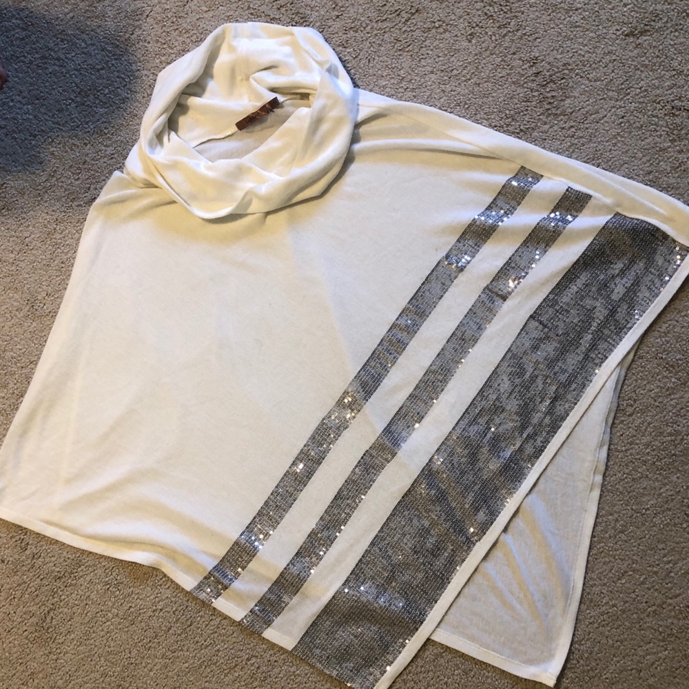 Cream shall with sequence embellishment